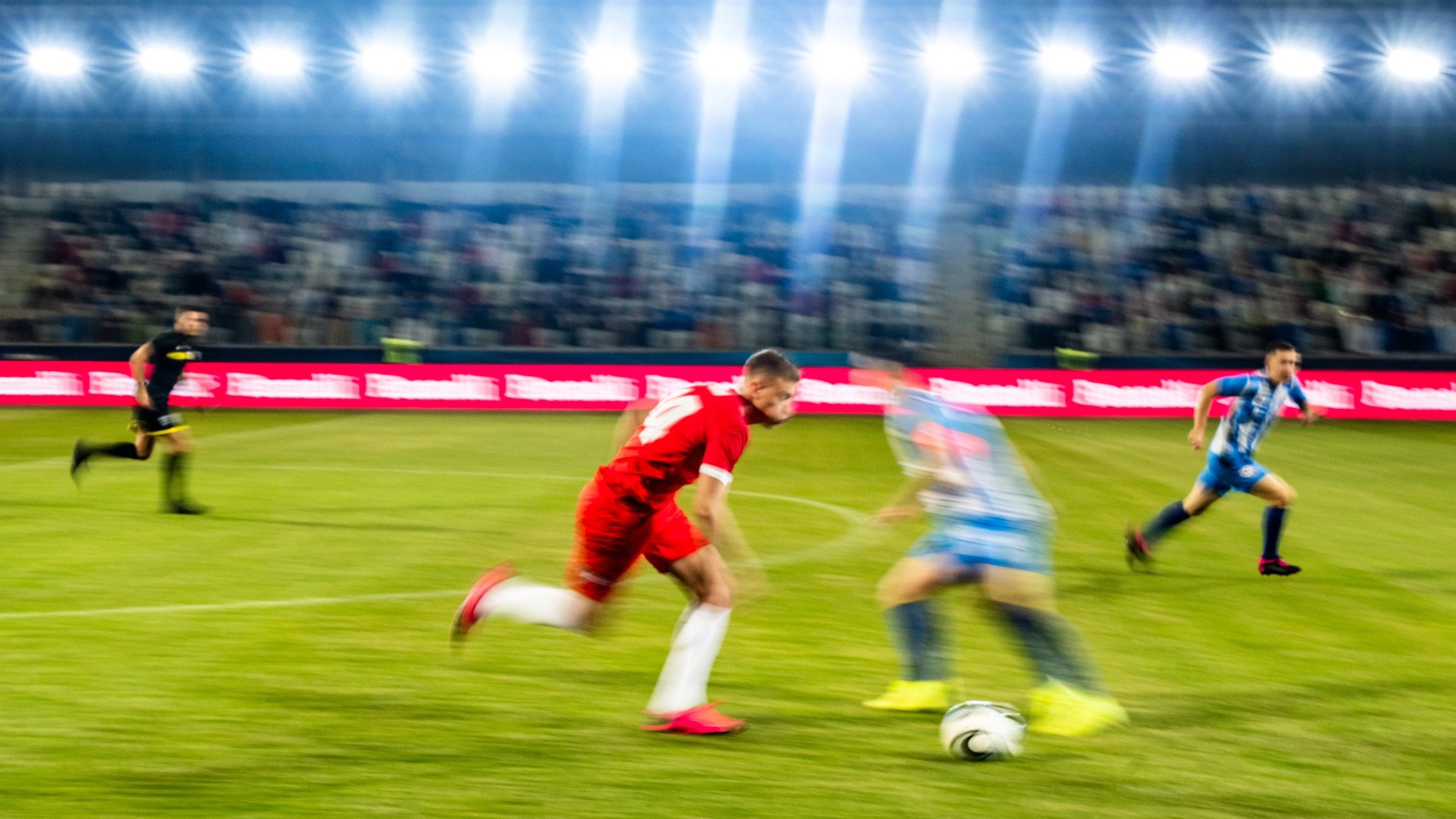 Football players competing during a match