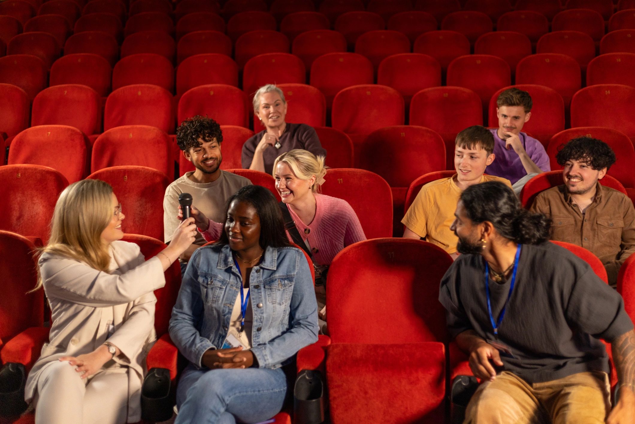 Audience participating during a live event in an auditorium